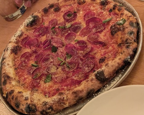 Wooden City signature dishes Beet RavioliFancy BurgerPepperoni Pizza